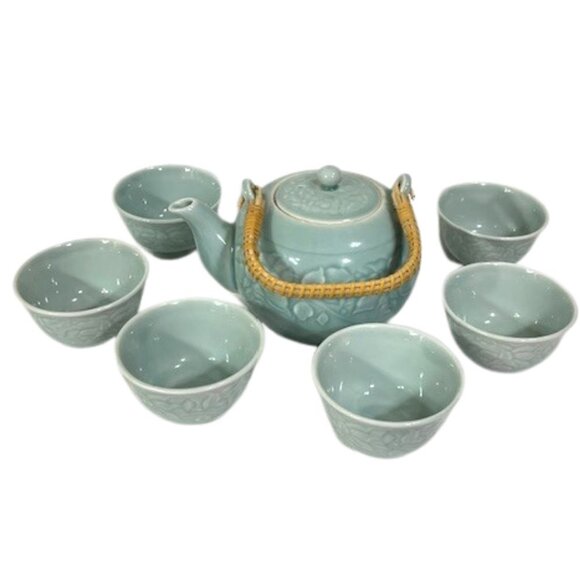 Vintage celedon teapot and six cups. Floral design.